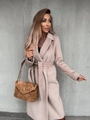 Detail of premium beige wool coat featuring a wide lapel and textured fabric finish - S / Apricot