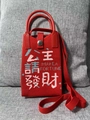 Detail of red knit mini bag with 'MAKE A FORTUNE' embroidery and snap closure - Princess Good Fortune Red