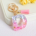 Glitter resin letter D keychain with pink tassels and gold moon butterfly charms - Letter D / Pink
