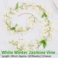 Guirnalda de jazmín artificial blanco de 185cm con 120 flores y 12 hojas verdes - 120 Flores Jazmín de Invierno / Blanco