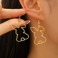 Hollow gold bunny dangle earrings in stainless steel for women shown on model - Hollow Drop Style (WG-0669) / Gold
