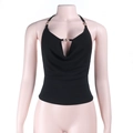 Detail of black cowl neck halter top with a decorative golden sun charm on a mannequin - S / Black