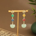 Detail of Chinese style earrings with gold tassels and green Ruyi jade-like pendants - Bow Ruyi Enamel (E6462)