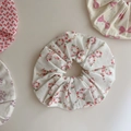Detail shot of soft cotton floral hair scrunchies with elegant pleats and red flower patterns - Colorful Floral Bow