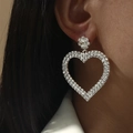 Silver oversized heart-shaped hoop earring with shimmering crystals on model - Heart Shape / Silver Heart DTE1516232S