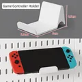 White L-shaped plastic gamepad holder for pegboard storage system with dimensions - Game Controller Stand - White