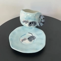 Irregular ceramic coffee cup and saucer set featuring hand-painted grey tabby cat motif - Blue Cat Cup & Saucer