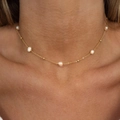 Elegant 18k gold plated stainless steel snake chain with pearls on a female model neck - Freshwater Pearl Necklace