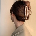 Elegant large golden hair claw clip with white pearls worn by a woman with brown hair - Pearl + Crystal Style(FJ130)