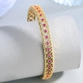 Elegant 18k gold-plated cuff bracelet with hollow mesh design and red ruby-like gemstones - Red