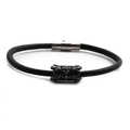 Detail of black leather bracelet with hollow carved metal bead and magnetic clasp closure - Black