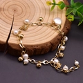 Elegant gold chain bracelet with white pearls and textured metal beads on a wood stand - Adjustable White Pearl Metal Ball Bracelet