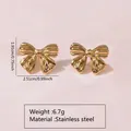 Polished golden bow stud earrings in stainless steel, size 2.51cm by 1.91cm - Polished Bow Style (FYD6114)