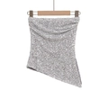 Silver sequin strapless tube top with an asymmetrical hem displayed on a wooden hanger - XS / Silver