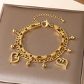 Golden double-layer stainless steel bracelet with hollow heart charms and white zircons - Hollow Rhinestone Heart Style (KB203676-Z)