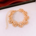 Close-up of golden rose bracelet with diamond accents and secure lobster clasp closure - Bracelet - Gold