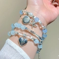 Bracciale bohémien multistrato in cristallo azzurro con ciondoli a stella marina - Set Cuore Conchiglia Blu (24 Set di 3 Bracciali)