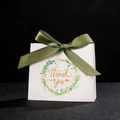 White wedding favor box with green satin bow and golden Thank You wreath print - Wreath Leaves + Green Ribbon