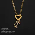 Gold stainless steel necklace with heart clasp and stethoscope charm with pink stone - Letter Q