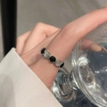 925 silver eternity ring with alternating black and white gemstones on model finger - Silver Black White Gem Alternate Ring (J4979)