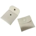 Detail view of cream velvet jewelry pouches with snap button closure in open and closed states - 8*8cm / Off White