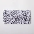 Detail of soft nylon baby headband with classic black and white soccer print and bow knot - White Soccer Pattern