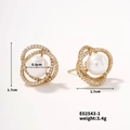 Detail view of 1.7cm golden stud earring featuring a white pearl and zircon pave accents - Multi-ring Style (E02543-1)