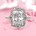 Elegant halo ring featuring a large radiant cut crystal and pavé set silver band - US 7 / White Gold