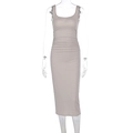 Detailed view of the ruched waist design on a slim-fit dark beige bodycon midi dress - S / Nude