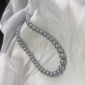 Macro detail of round Akoya-style pearls on white silk showing deep metallic luster - S925 Silver Buckle/Faux Pearl / 10mm/40cm