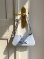 Minimalist light blue baguette shoulder bag with stylish bow accent in smooth leather - Blue