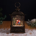 Detalle de farol navideño de bronce con escena de muñeco de nieve y purpurina interna - Muñeco de nieve