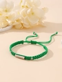 Detailed macro view of green braided cord bracelet with silver metal bar and adjustable slide - Green (Silver Plate)