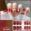 Detail of Christmas nail stickers with reindeer and tree patterns in red cat eye style - CS424