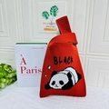 Red knit wrist bag with a cute sleeping panda pattern and Black text embroidery - Letter Panda Orange