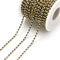 Gold plated DIY craft chain with alternating dark green and white rhinestones on a roll - 2mm Green
