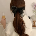 Elegant black double-sided bow hair claw clip for women shown on a ponytail hairstyle - Chiffon Bow Banana Clip / Black