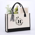 Canvas tote bag in beige and black with letter H print and decorative striped ribbon - Letter-H