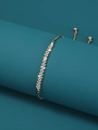 Adjustable gold tree of life bracelet with sparkling cubic zirconia on a teal stand - Wave Style (NB677)