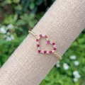 18K gold plated heart bracelet featuring red and white zircon stones on a twisted chain - Gold/Red Zirconia