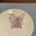 Detailed macro of a light purple translucent butterfly hair claw clip with resin texture - Jelly Purple