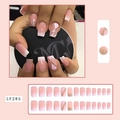 Detailed view of long pink gradient press-on nails with gold glitter and white line art - LF285 Nude Pink Gradient Glitter White Lines