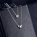 Silver layered necklace with round clear gemstone and heart pendant on jewelry box - Double Layer Heart Zirconia Necklace