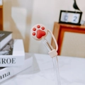Beige silicone straw cover with red cat paw design for high borosilicate glass straws - Cat Claw Straw Cover