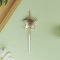 Rose gold star-shaped birthday cake candle with white stick on a minimalist background - Pentagram / Champagne