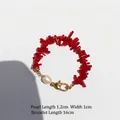 Red irregular beaded coral-style bracelet with freshwater pearl and golden heart clasp - Bracelet