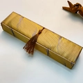 Detail of vintage rectangular golden brocade jewelry gift box with brown tassel - Necklace Box (Long Strip)