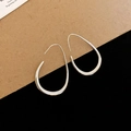Close-up of silver water drop earrings on brown paper and black velvet background - Silver Teardrop Ear Hook (1#)