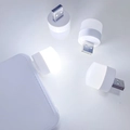 Creative USB LED night light plugged into power bank emitting soft white light - White