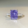 Macro shot of 925 silver ring featuring a radiant cut purple gemstone and diamond band - Lavender Purple Zirconia